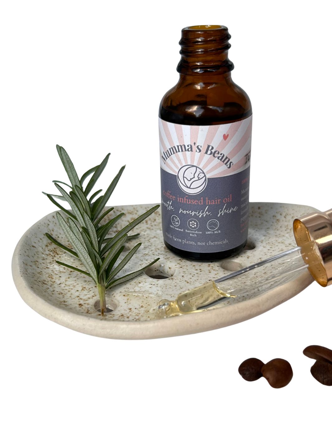 Hair Oil with Rosemary from Mumma's Beans Coffee in a glass dropper bottle