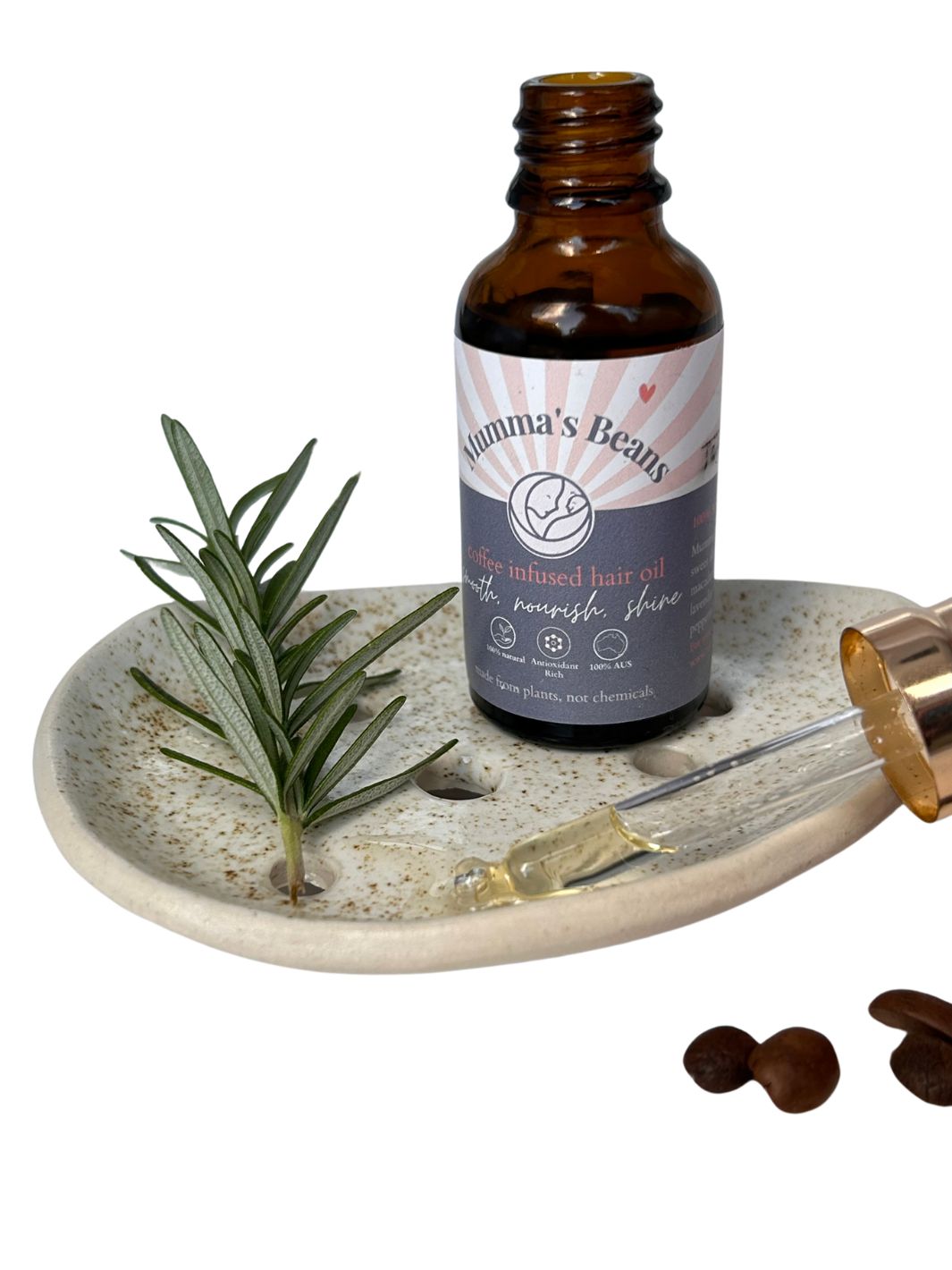 Rosemary hair oil with coffee and peppermint from Mumma's Beans Coffee in a glass dropper bottle