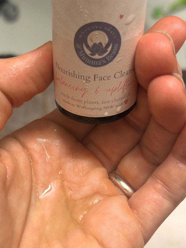 nourishing gentle face cleanser in hand