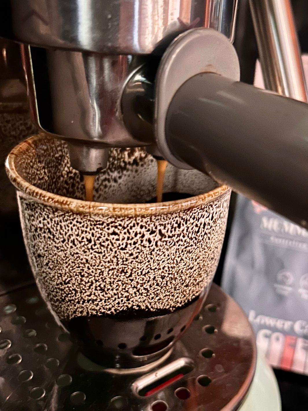 coffee brewed into ceramic cup