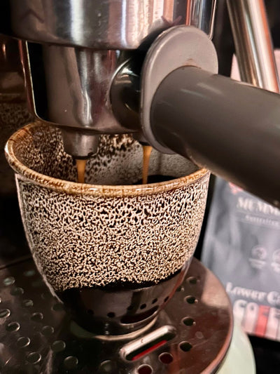 coffee brewed into ceramic cup