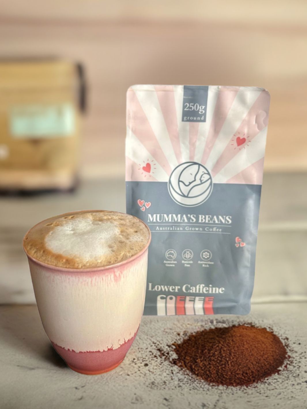 ground lower caffeine coffee with cup and bag of coffee